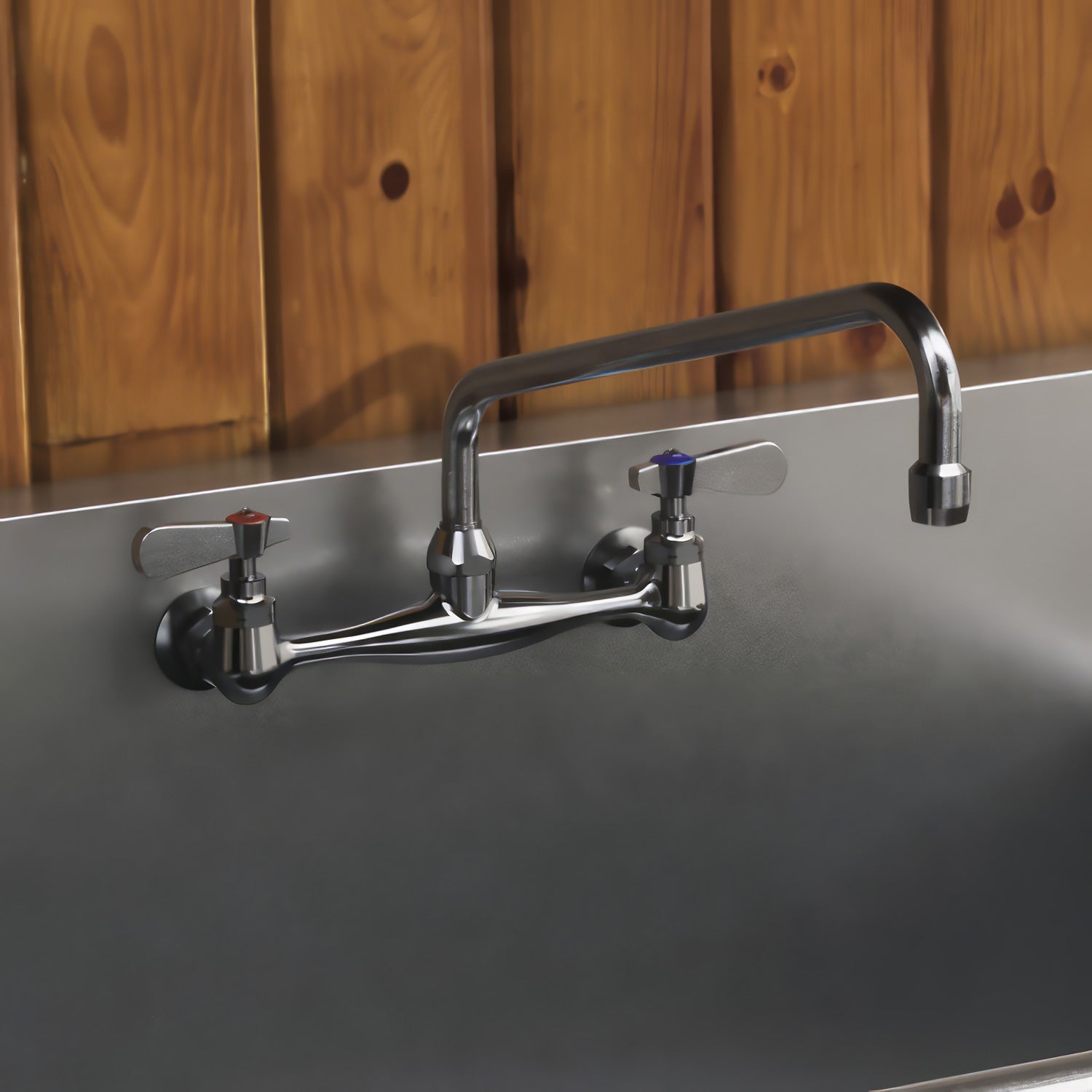 Solid brass wall mount utility faucet with extended swivel spout and lever handles
