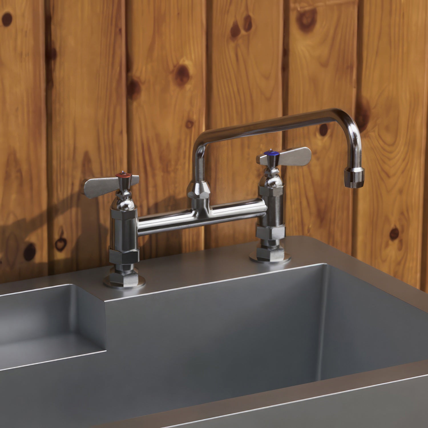 Solid brass utility bridge faucet with an extended swivel spout and lever handles