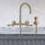 Wall Mount Faucet with a Long Gooseneck Swivel Spout, Lever Handles and Solid Brass Side Spray