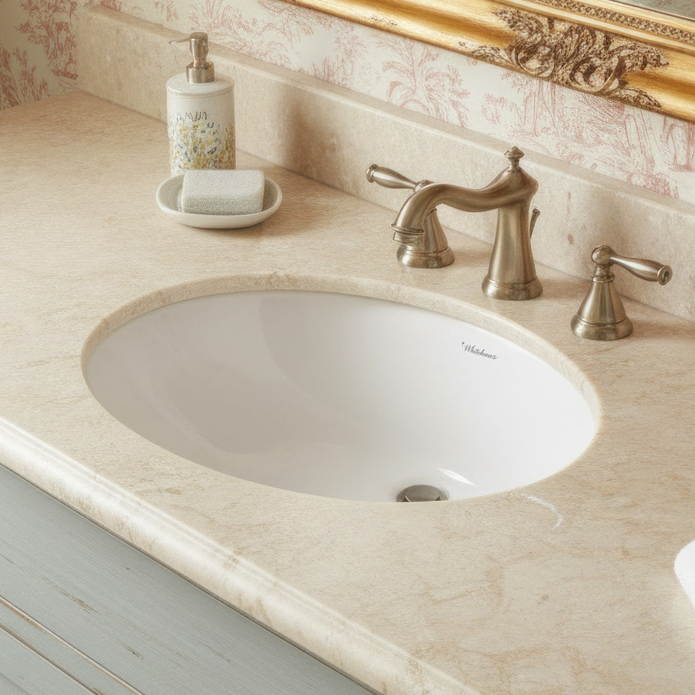 Oval undermount basin with overflow and rear center drain location