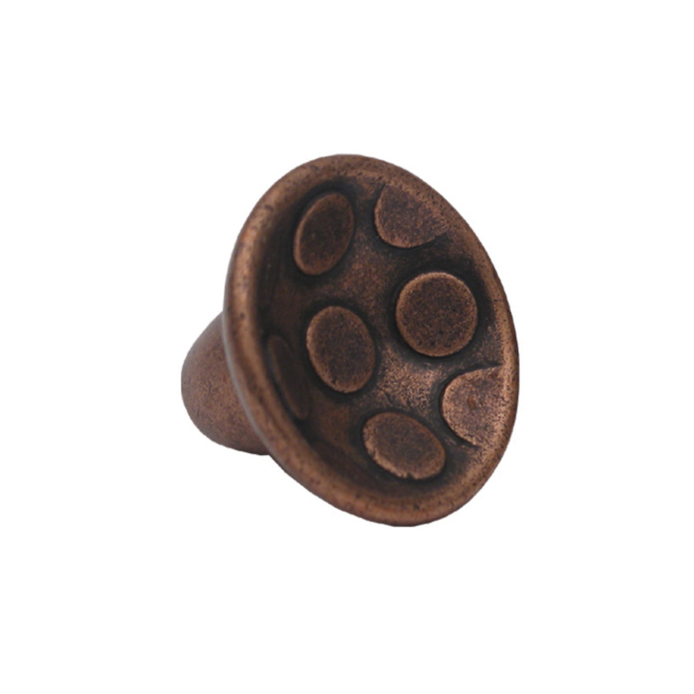 Circular-shaped knob with circular inlays made of solid brass.