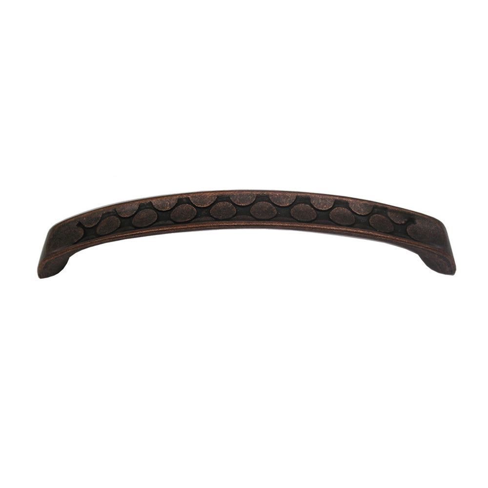 Curved pull handle with circular inlays made of solid brass.